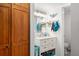 Well-lit bathroom with spacious vanity, mirror, and adjacent closet at 19505 Quesada Ave # F103, Port Charlotte, FL 33948