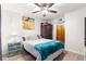 Comfortable bedroom with ceiling fan, closet space, and neutral decor at 19505 Quesada Ave # F103, Port Charlotte, FL 33948