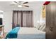 Bright bedroom featuring a window and large wardrobe with decorative painting at 19505 Quesada Ave # F103, Port Charlotte, FL 33948