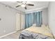 Comfortable bedroom with ceiling fan, closet, and natural light at 19505 Quesada Ave # F103, Port Charlotte, FL 33948