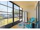 Enclosed patio featuring comfortable seating and storage with natural light streaming through at 19505 Quesada Ave # F103, Port Charlotte, FL 33948