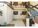 Exterior stairwell with open landing to unit doors, featuring simple landscaping at 19505 Quesada Ave # F103, Port Charlotte, FL 33948