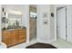 This bright bathroom features a walk-in shower, vanity, and tiled floor at 21 Manizaks Ave, Punta Gorda, FL 33983