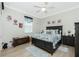 This bedroom has a ceiling fan, wood-look floors and plenty of room for furniture at 21 Manizaks Ave, Punta Gorda, FL 33983