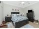 This bedroom has a ceiling fan, wood-look floors and plenty of room for furniture at 21 Manizaks Ave, Punta Gorda, FL 33983