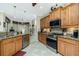 Modern kitchen featuring granite countertops, stainless steel appliances, and a view of the breakfast nook at 21 Manizaks Ave, Punta Gorda, FL 33983