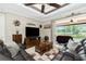 Comfortable living room with a view of the screened in patio and backyard at 21 Manizaks Ave, Punta Gorda, FL 33983