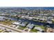 Waterfront property with backyard canal access and a beautiful neighborhood view on a sunny day at 21269 Edgewater Dr, Port Charlotte, FL 33952