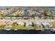 Canal-front property features a private boat dock, an enclosed pool and mature landscaping at 21269 Edgewater Dr, Port Charlotte, FL 33952