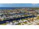Aerial view of canal front home featuring a private boat dock and screened-in pool at 21269 Edgewater Dr, Port Charlotte, FL 33952