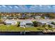 Home featuring a backyard with boat dock and a screened-in pool at 21269 Edgewater Dr, Port Charlotte, FL 33952