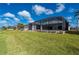 A spacious, well-maintained backyard with a screened-in pool enclosure at 21269 Edgewater Dr, Port Charlotte, FL 33952