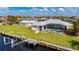 A waterfront home has a boat dock, screened in lanai, and well-maintained backyard at 21269 Edgewater Dr, Port Charlotte, FL 33952