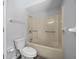 Neutral bathroom featuring a standard toilet and bathtub with shower head at 21269 Edgewater Dr, Port Charlotte, FL 33952