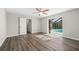 Bedroom offers new flooring, closet, ceiling fan, and screened-in pool views at 21269 Edgewater Dr, Port Charlotte, FL 33952