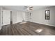 Spacious bedroom with wood-look flooring, closet, and ample natural light from the windows at 21269 Edgewater Dr, Port Charlotte, FL 33952