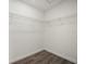 Walk-in closet with wood-look floors and metal shelving at 21269 Edgewater Dr, Port Charlotte, FL 33952