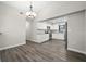 Bright dining area adjacent to the kitchen with modern lighting and wood flooring at 21269 Edgewater Dr, Port Charlotte, FL 33952