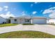 Charming home with a two-car garage, well-manicured lawn, and a spacious driveway at 21269 Edgewater Dr, Port Charlotte, FL 33952
