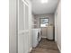 A functional laundry area with washer, dryer, and water heater at 21269 Edgewater Dr, Port Charlotte, FL 33952