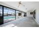 Enclosed pool with ceiling fans and access to the waterfront view at 21269 Edgewater Dr, Port Charlotte, FL 33952