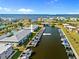 Aerial view of the condo with canal access showing assigned boat slips and coastal views at 220 Coldeway Dr # 211, Punta Gorda, FL 33950