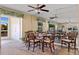 Charming dining room with wood furniture and view of a bright and airy patio at 220 Coldeway Dr # 211, Punta Gorda, FL 33950