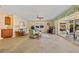 Spacious living room featuring tile flooring, comfortable seating, and views of the lanai at 220 Coldeway Dr # 211, Punta Gorda, FL 33950
