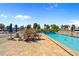 Community pool with lounge chairs and tables perfect for outdoor gatherings at 220 Coldeway Dr # 211, Punta Gorda, FL 33950