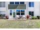 Charming condo exterior with a private patio, offering a cozy outdoor seating area at 2300 Aaron St # 106, Port Charlotte, FL 33952