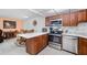Updated kitchen featuring stainless steel appliances and a breakfast bar at 2300 Aaron St # 106, Port Charlotte, FL 33952