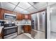 Bright kitchen featuring stainless steel appliances and tiled backsplash at 2300 Aaron St # 106, Port Charlotte, FL 33952