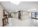 Well-lit lobby area with tile flooring, neutral walls, and an elevator providing convenient access to the building's amenities at 2300 Aaron St # 106, Port Charlotte, FL 33952