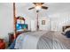 Main bedroom with a TV, ceiling fan and access to the main bathroom at 2300 Aaron St # 106, Port Charlotte, FL 33952