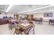 Inviting recreation room with tables, chairs, and cozy seating areas, perfect for socializing and community events at 2300 Aaron St # 106, Port Charlotte, FL 33952
