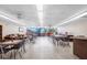 Bright and spacious recreation room with tables, seating, and large windows providing natural light and a comfortable social space at 2300 Aaron St # 106, Port Charlotte, FL 33952