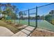 View of the well-maintained tennis courts, providing residents with an excellent recreational amenity and active lifestyle option at 2300 Aaron St # 106, Port Charlotte, FL 33952