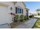 Charming single-story home with well-maintained landscaping, walkway and an attached two car garage at 25199 Chiclayo Ave, Punta Gorda, FL 33983