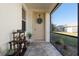 Inviting front porch with potted plants and a decorative wreath on the front door at 25199 Chiclayo Ave, Punta Gorda, FL 33983