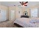 Comfortable main bedroom boasts a ceiling fan, neutral carpet, and a window at 25199 Chiclayo Ave, Punta Gorda, FL 33983