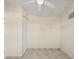Bedroom with a ceiling fan, closet and light colored walls and tile floor at 3124 Crestwood Dr, Port Charlotte, FL 33952