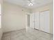 A bedroom with tile flooring, a ceiling fan, and closet space at 3124 Crestwood Dr, Port Charlotte, FL 33952