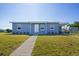 Charming single story home featuring a well maintained lawn and a clean, modern exterior at 3124 Crestwood Dr, Port Charlotte, FL 33952