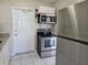 Updated kitchen featuring stainless steel appliances, sleek countertops and white cabinets at 3124 Crestwood Dr, Port Charlotte, FL 33952