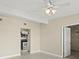 Bright living room with tile floors, ceiling fan, and view into the updated kitchen at 3124 Crestwood Dr, Port Charlotte, FL 33952