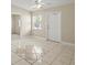 Cozy living room featuring tile flooring, a ceiling fan, and natural light from the window at 3124 Crestwood Dr, Port Charlotte, FL 33952