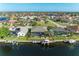 Aerial view of waterfront homes featuring private docks, boat lifts, and inviting pools in a desirable community at 333 Santander Ct, Punta Gorda, FL 33950