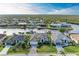 Stunning aerial view of waterfront homes on a canal, showcasing lush landscaping and private boat docks at 333 Santander Ct, Punta Gorda, FL 33950