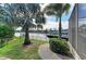 Lush backyard with well-maintained lawn, waterfront access, and a boat lift, perfect for boat enthusiasts at 333 Santander Ct, Punta Gorda, FL 33950