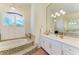Bathroom featuring an elevated tub, mosaic tile, and bright lighting fixtures at 333 Santander Ct, Punta Gorda, FL 33950